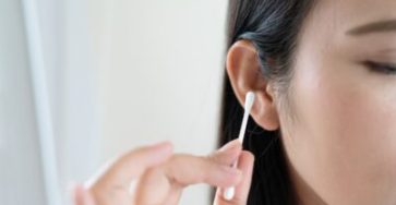 Woman,Cleaning,Ear,With,Cotton,Swab.,Healthcare,And,Ear,Cleaning