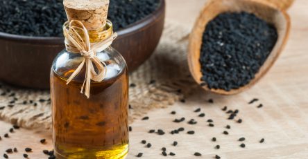Black,Cumin,Seeds,And,Essential,Oil,With,Bowl,And,Wooden
