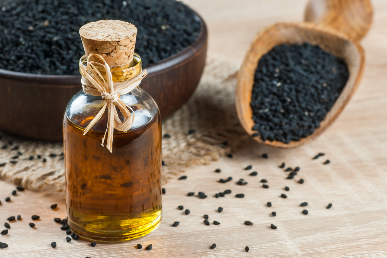 Black,Cumin,Seeds,And,Essential,Oil,With,Bowl,And,Wooden